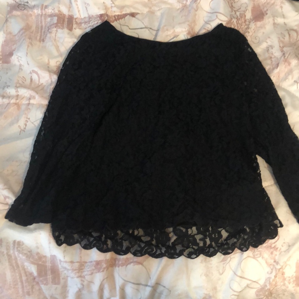 A black flower print blouse. Little open back.